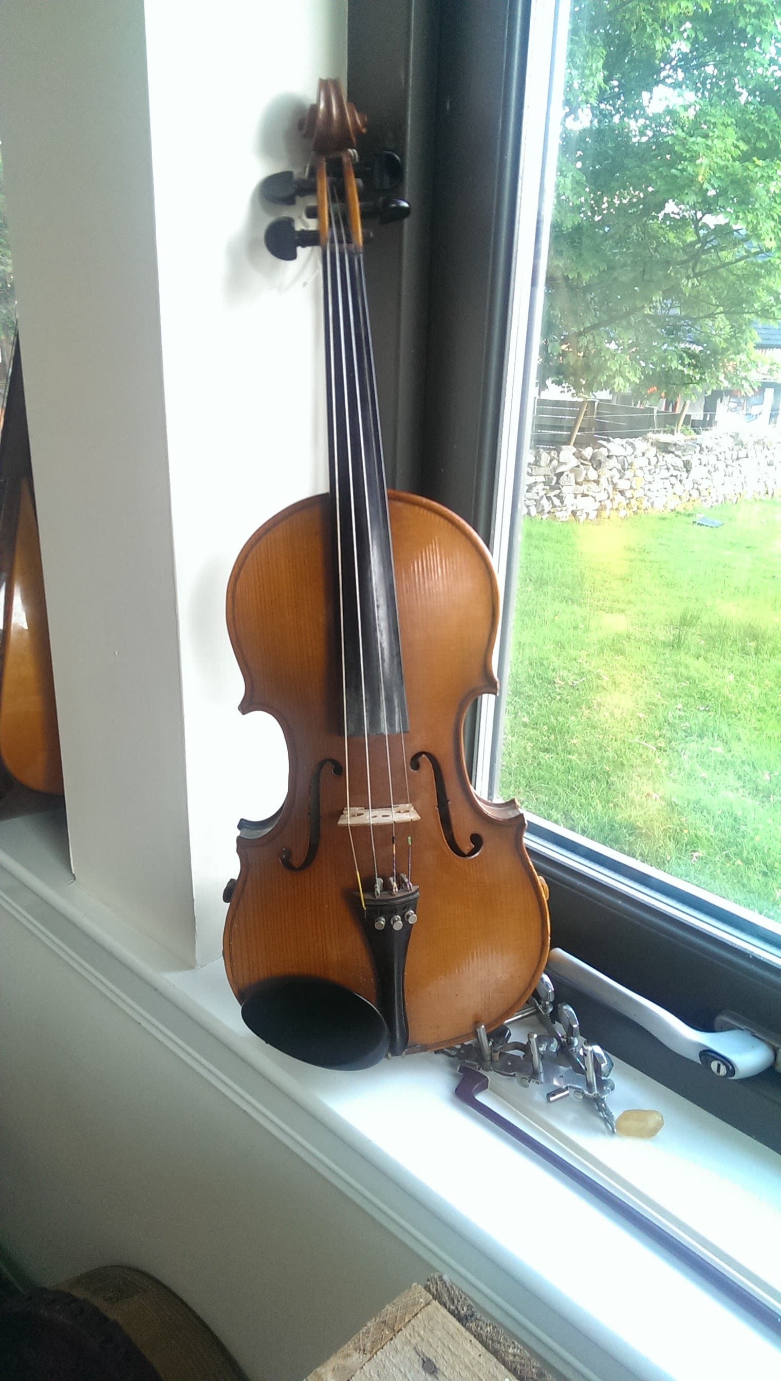 Prajakta's son practicing violin and table tennis